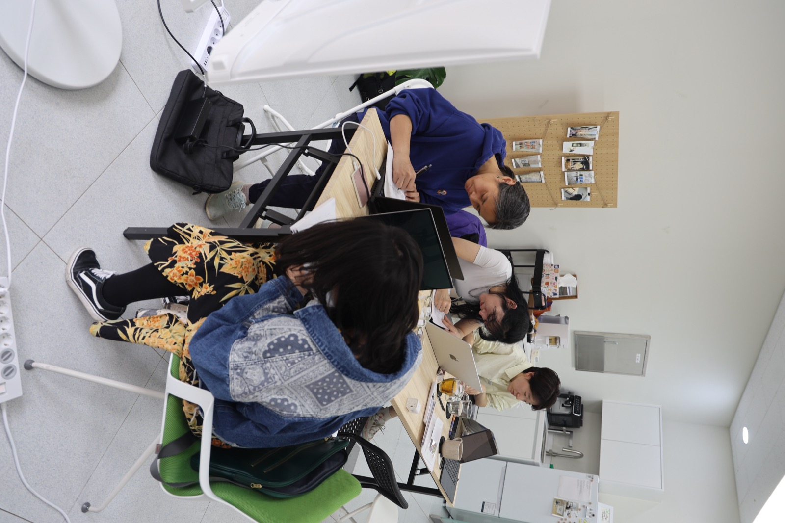Overhead view of artists working together